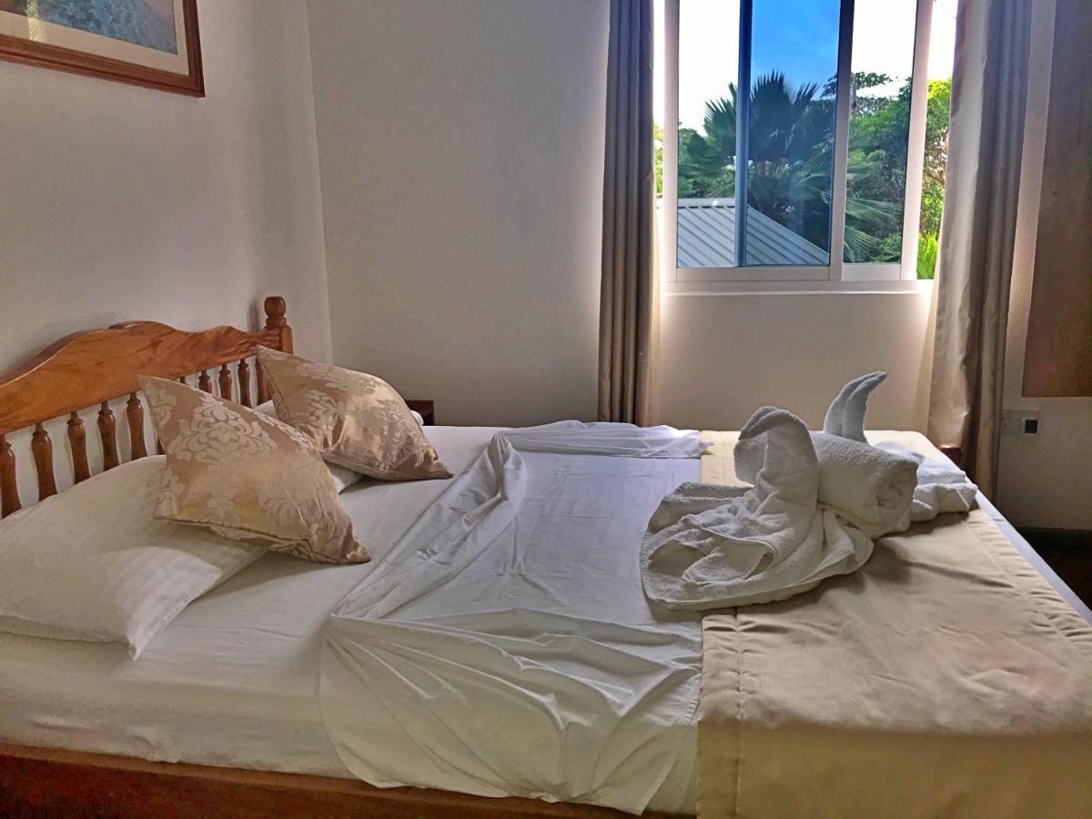 Acquario Guesthouse Anse Volbert Village Buitenkant foto